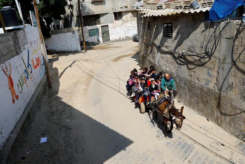 Children in Gaza travel to school on a donkey cart. All photos: Reuters 