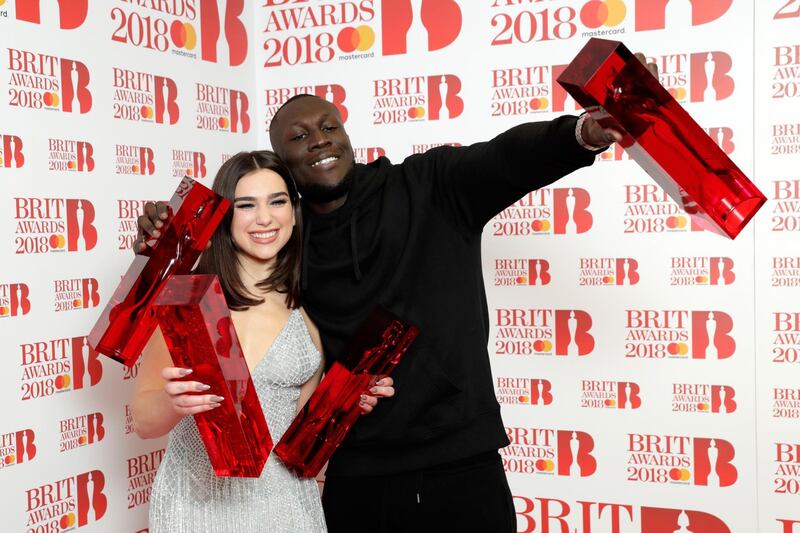 Dua Lipa, winner of the British Female Solo Artist and British Breakthrough act awards and Stormzy, winner of the British Album of the Year and British Male Solo Artist awards, pose in the winners room. John Phillips/Getty Images