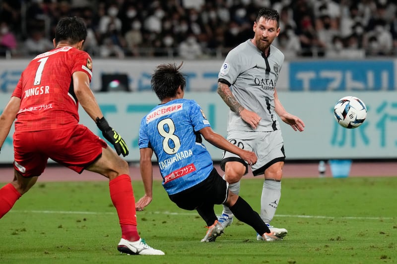 PSG's Lionel Messi has a shot at goal blocked by Kento Tachibanada of Kawasaki Flontale. AP