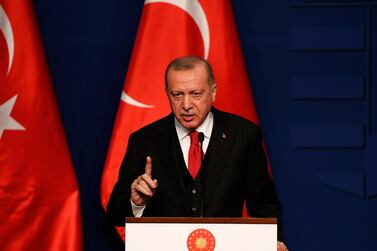 Turkish President Recep Tayyip Erdogan speaks to the press. Laszlo Balogh / Getty Images