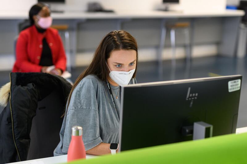 Students work on computers in the Social Learning Zone at the University of Bolton. Oli Scarff / AFP