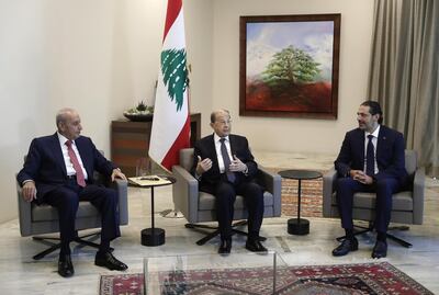 Lebanese President Michel Aoun, center, meets with Prime Minister-Designate Saad Hariri, right, and Lebanese Parliament Speaker Nabih Berri, at the Presidential Palace in Baabda, east of Beirut, Lebanon, Thursday, Oct, 22, 2020. Lebanon's president Michel Aoun asked former premier Saad Hariri to form the country's next government Thursday after he secured enough votes from lawmakers - bringing back an old name to lead the country out of its dire political and economic crises. (Anwar Amro, Pool via AP)