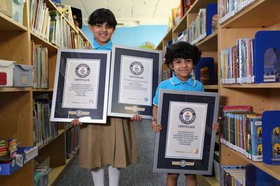 Saeed Rashed AlMheiri, right, and AlDhabi Rashed AlMheiri, left, with their Guinness World Record certificates. Nilanjana Gupta/ The National