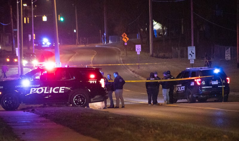 Police at the scene in East Lansing. The gunman killed himself after the shooting. AP