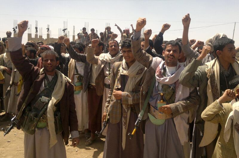 (FILES) In this file photo taken on March 23, 2014, Shiite rebels, known as Huthis or Ansarullah, chant slogans in the city of Amran, 50 kms north of Sanaa. Fifty kilometres (30 miles) north of Sanaa, Amran was taken by the Iran-backed Huthis on July 8, 2014. The Huthis overran government forces in Amran after a two-month siege and then moved south, capturing the capital in September 2014 before pushing into other parts of Yemen. / AFP / Gamal NOMAN
