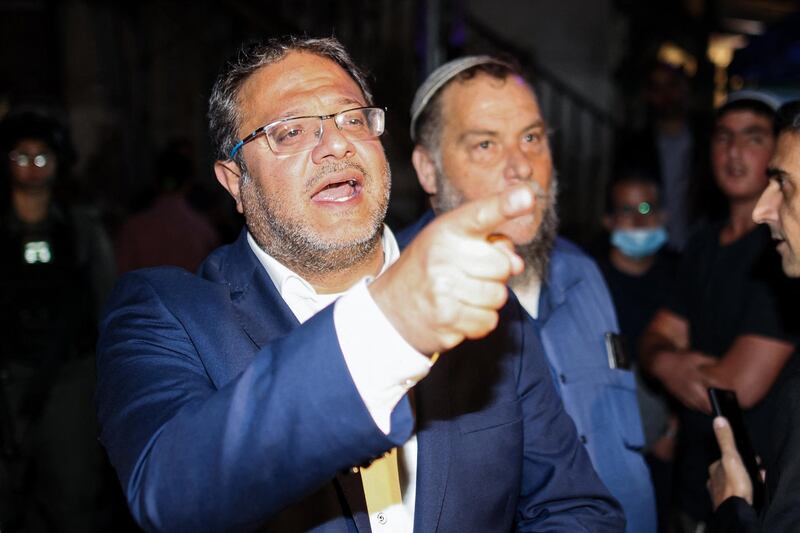 Israeli Knesset member Itamar Ben-Gvir, left, head of the Otzma Yehudit (Jewish Power) party, arrives in Sheikh Jarrah, East Jerusalem on May 6, 2021. AFP