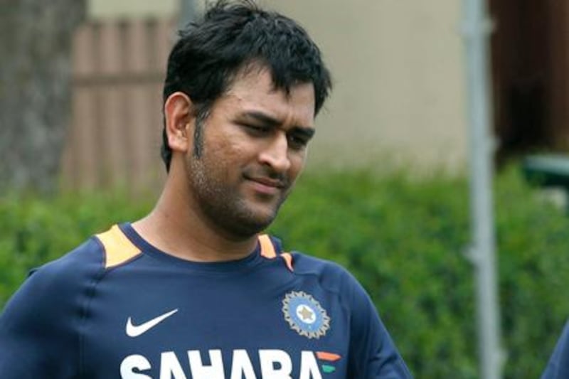 India's Twenty20 international cricket captain MS Dhoni walks on the field after batting practice in the nets in Sydney, Australia,  Tuesday, Jan. 31, 2012. (AP Photo/Rob Griffith)