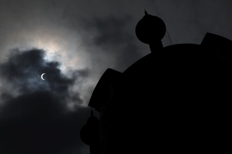 A partial solar eclipse is seen in Kuala Lumpur, Malaysia.  REUTERS