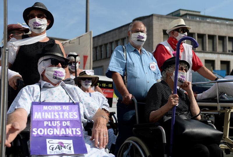 Demonstrators take part in a rally organised by workers of Belgian public health amid the coronavirus outbreak, in central Brussels, Belgium. Reuters