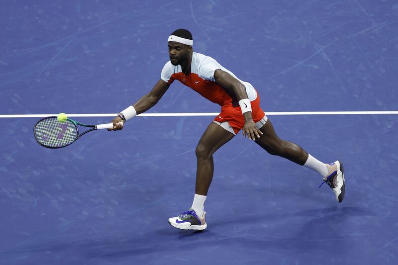 Frances Tiafoe returns a shot against Carlos Alcaraz. AFP