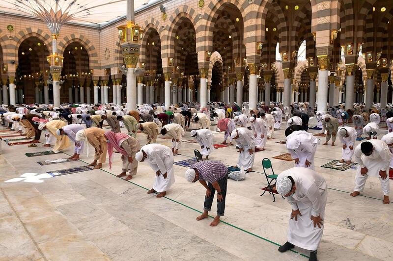 Muslims perform the Friday prayers inside the Masjid Al Nabawi while practising social distancing, following the outbreak of the coronavirus disease, in Madina, Saudi Arabia June 5, 2020. Saudi Press Agency/Handout via REUTERS