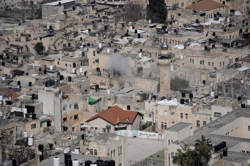 Smoke above a Nablus neighbourhood as Palestinians clash with Israeli forces. AP