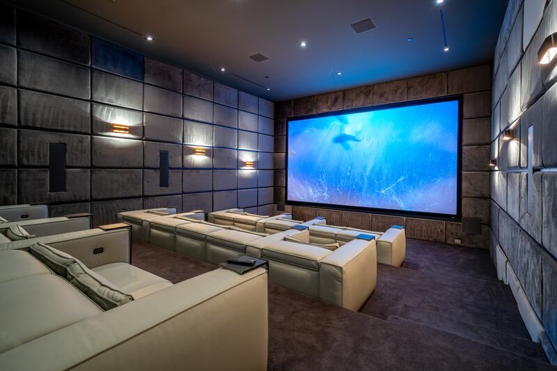 An elegant home theatre with motorised seating.