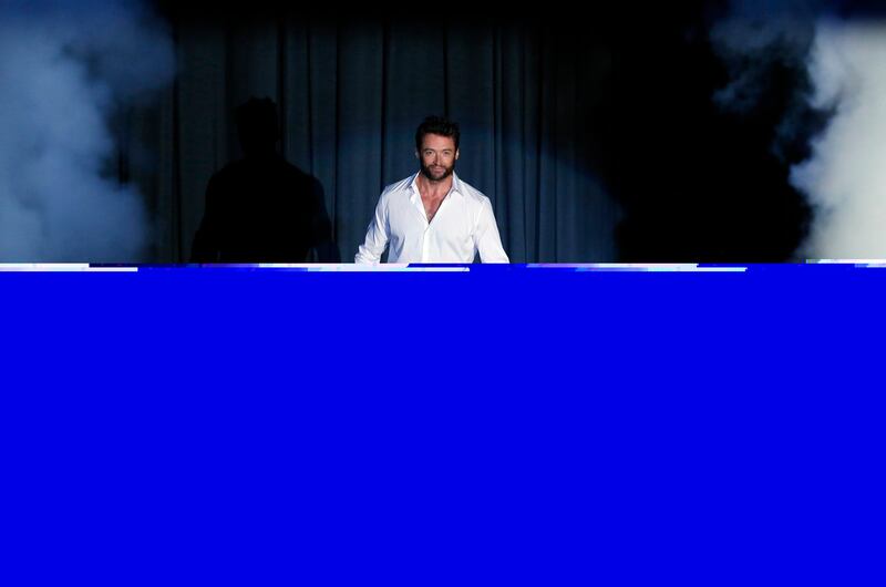 Actor Hugh Jackman arrives at a news conference to promote his new movie "The Wolverine" at a hotel in Seoul July 15, 2013.   REUTERS/Kim Hong-Ji (SOUTH KOREA - Tags: ENTERTAINMENT) *** Local Caption ***  SEO204_KOREA-_0715_11.JPG