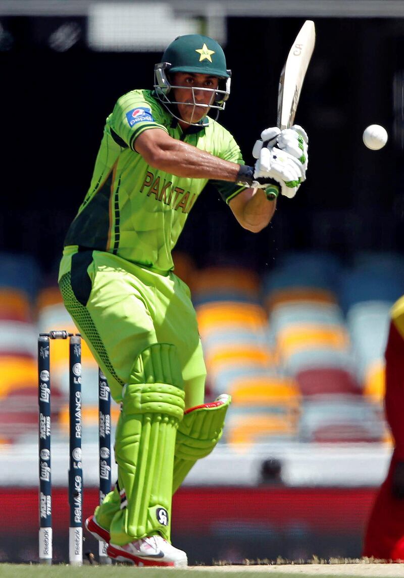 Pakistan's Nasir Jamshed prepares to hit a shot and be caught out for one run during the Cricket World Cup match against Zimbabwe at the GABBA in Brisbane March 1, 2015.    REUTERS/Jason Reed   (AUSTRALIA - Tags: SPORT CRICKET)
