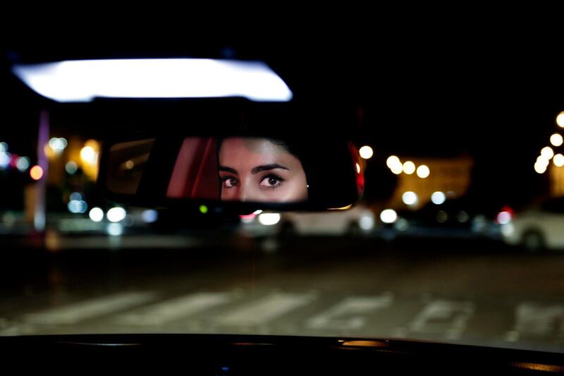 Hessah al-Ajaji drives her car down the capital's busy Tahlia Street after midnight for the first time in Riyadh, Saudi Arabia. Nariman El-Mofty / AP Photo