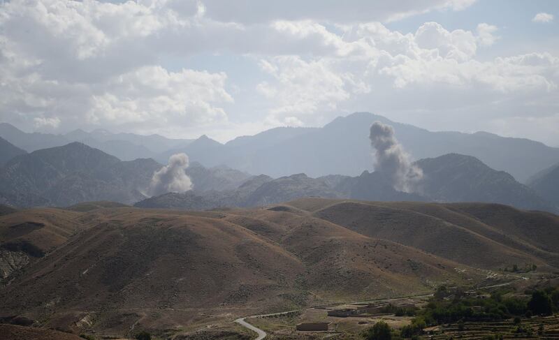 In this photo taken on July 7, 2018, smoke rises after an air strike bomb on Islamic State (IS) militants positions in a checkpoint at the Deh Bala district in the eastern province of Nangarhar Province. A US soldier was killed and two others wounded in an "apparent insider attack" in southern Afghanistan on July 8, NATO said, the first such killing in nearly a year. / AFP / WAKIL KOHSAR
