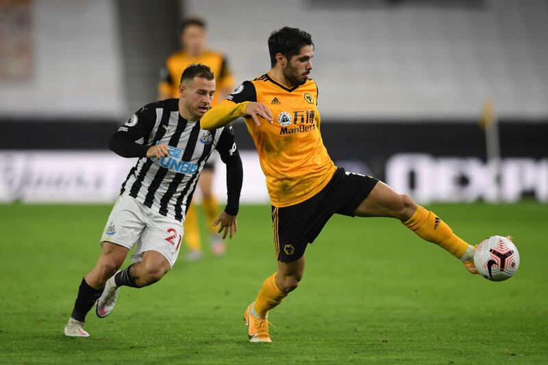 Wolverhampton Wanderers' Pedro Neto, right, controls the ball past Newcastle's Ryan Fraser at the Molineux Stadium. AP