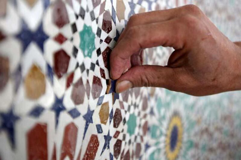 DUBAI, UNITED ARAB EMIRATES Ð May 24, 2011: Qasim Thaesh working on the mosaic in the Mehrab area at the under construction Al Farooq mosque in Al Safa area in Dubai. (Pawan Singh / The National) For News. Story by James

