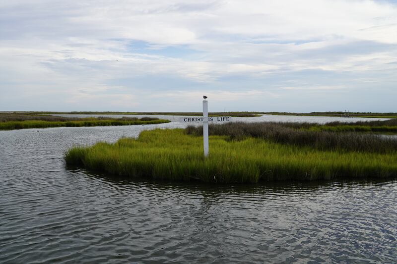 A cross rises from the marsh on Tangier Island in the Chesapeake Bay. Religion is an important part of life on Tangier. All photos: Willy Lowry / The National