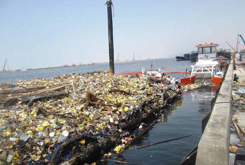 Tonnes of plastic waste are dredged from Dubai Creek every day by municipal crews. Courtesy Dubai Municipality