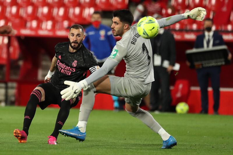 Real Madrid's striker Karim Benzema scores the fourth goal against Granada. EPA