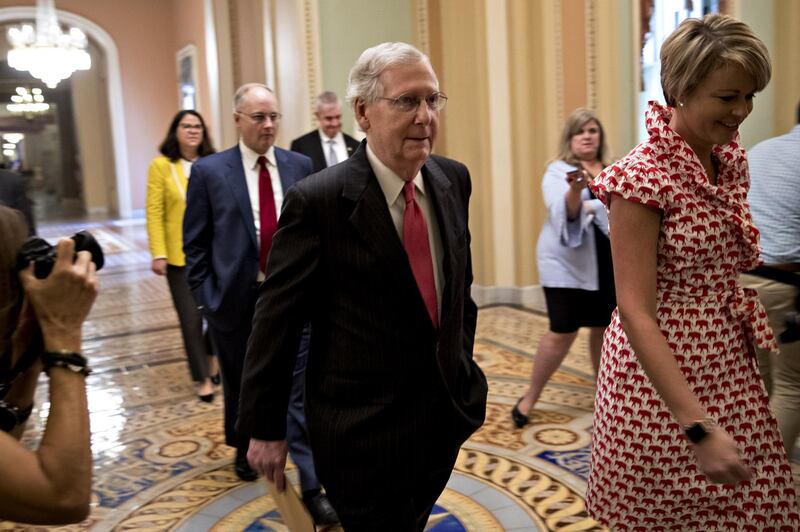 Senate Majority Leader Mitch McConnell, a Republican from Kentucky, center, walks toward the Senate floor at the U.S. Capitol in Washington, D.C., U.S., on Friday, Oct. 5, 2018. The U.S. Senate is closing in on sending Brett Kavanaugh to the Supreme Court, which would seal a conservative majority and close a bitterly fought confirmation process that hinged on allegations of sexual misconduct. Photographer: Andrew Harrer/Bloomberg