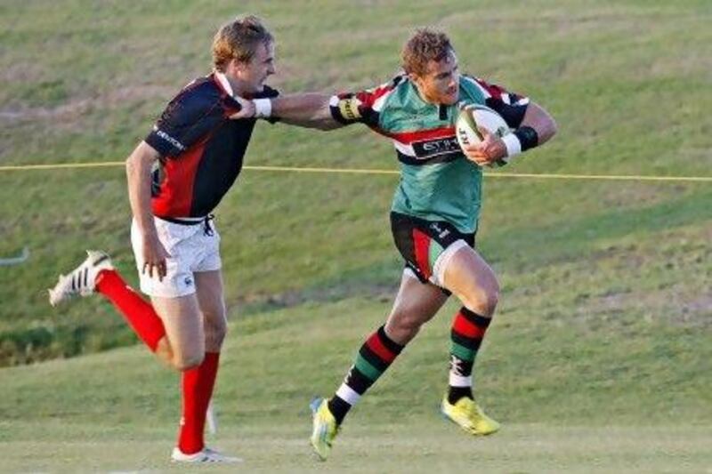Jeremy Manning, right, and the Abu Dhabi Harlequins put on a masterclass display against the young Dubai Exiles team.