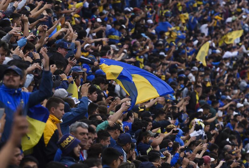 Boca Juniors fans cheer for their team during an open training session inside La Bombonera ahead of the Copa Libertadores final second leg. Getty Images