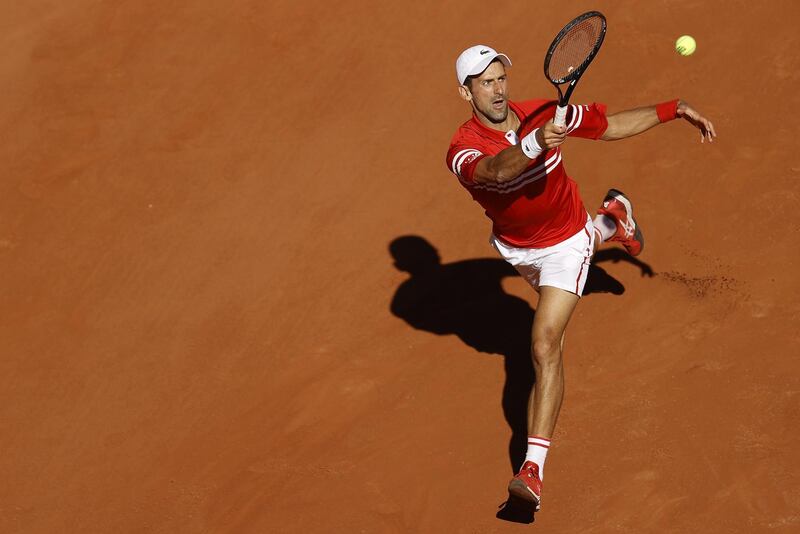 Novak Djokovic hits a forehand to Stefanos Tsitsipas during the French Open final. EPA