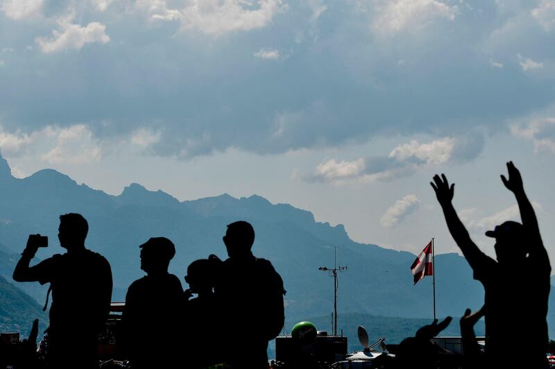 Spectators wait at the start line prior to the 10th stage of the Tour de France between Annecy and Le Grand-Bornand. Philippe Lopez / AFP