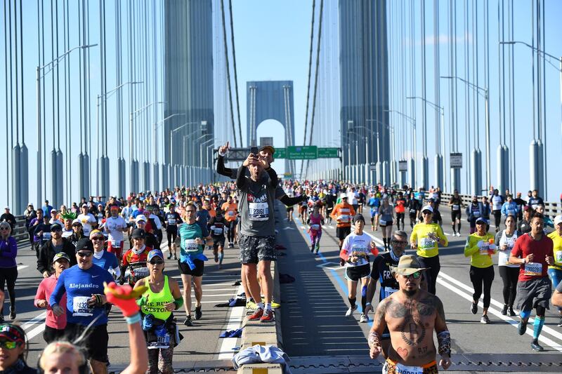 Runners cross the Verrazzano-Narrows Bridge during the 2019 TCS New York City Marathon in New York on November 3, 2019. (Photo by Johannes EISELE / AFP)