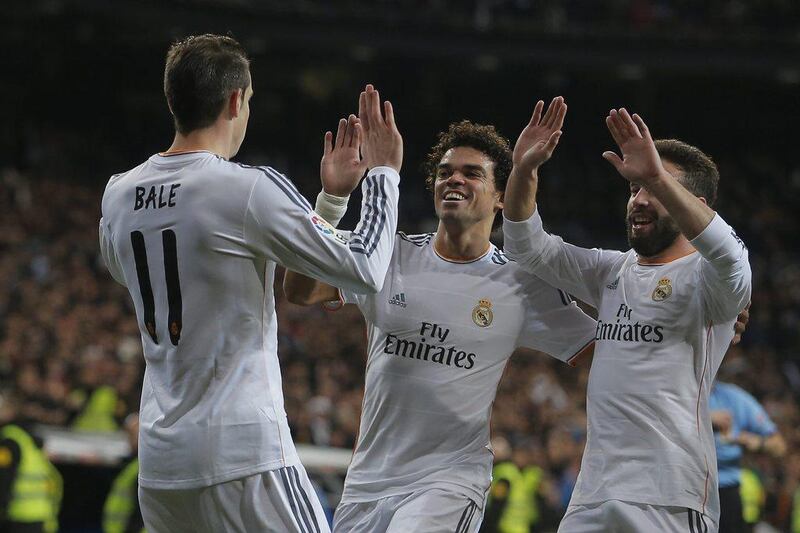 Gareth Bale celebrates after scoring Real Madrid's first goal on Saturday. Andres Kudacki / AP 
