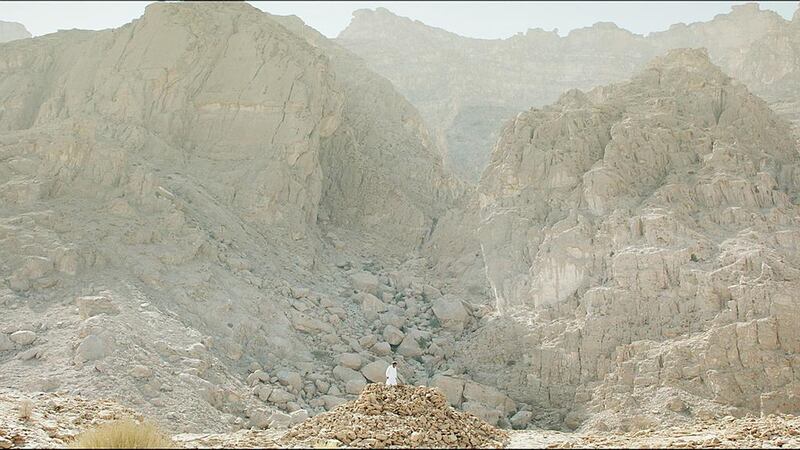 A still from The Digger showing Sultan Zeib Khan, the caretaker of the Neolithic necropolis at Jebel al-Buhais in Sharjah. Courtesy of the artist and filmmaker Galerie Imane Farès.