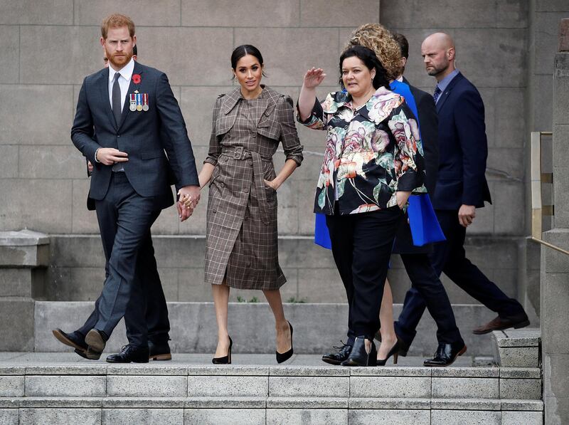 Prince Harry and Meghan, Duchess of Sussex, in Karen Walker, attend a wreath laying ceremony at Pukeahu National War Memorial Park on October 28, 2018 in Wellington, New Zealand