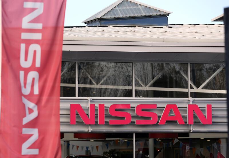 (FILES) In this file photo taken on October 25, 2016 Nissan flags fly at a Nissan car dealership in Sunderland, north east England on October 25, 2016. Nissan will stop production of Infiniti cars at its factory in Sunderland, northeast England, the Japanese carmaker said on March 12, 2019, one month after cancelling the plant's plans for the X-Trail SUV. Infiniti Motor Company, a division of Nissan, said in a statement that it would stop production of Q30 and QX30 crossover models in Sunderland by mid-2019 as part of a global restructuring, amid sector-wide turbulence including from Brexit.
 / AFP / SCOTT HEPPELL
