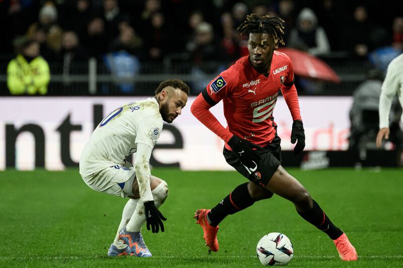 Rennes' Christopher Wooh fights for the ball with Paris Saint-Germain's Neymar. AFP