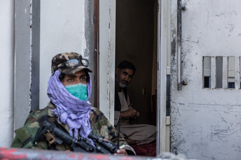 Taliban guards stand outside the Ministry of Information in Kabul. Stefanie Glinski / The National