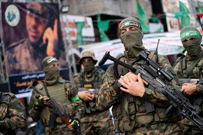 Hamas militants parade through the streets for Bassem Issa in Gaza Cityin May 2021. AP Photo