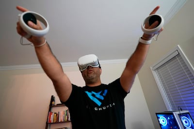 Pastor DJ  Soto, the lead pastor of VR Church, delivers a sermon in his home on January  23, in Fredericksburg, Virginia, US.  Soto sings, preaches and performs digital baptisms in the metaverse to a growing congregation of avatars. AP