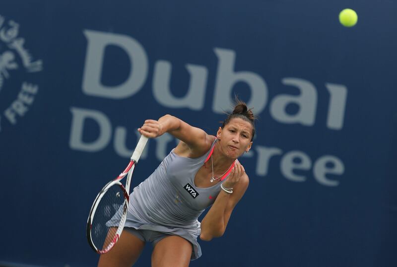 epa03589443 Ekaterina Bychkova of Russia in action against Jie Zheng of China during the first round of the Dubai Duty Free Tennis Championships in Dubai, United Arab Emirates, 18 February 2013.  EPA/ALI HAIDER *** Local Caption ***  03589443.jpg