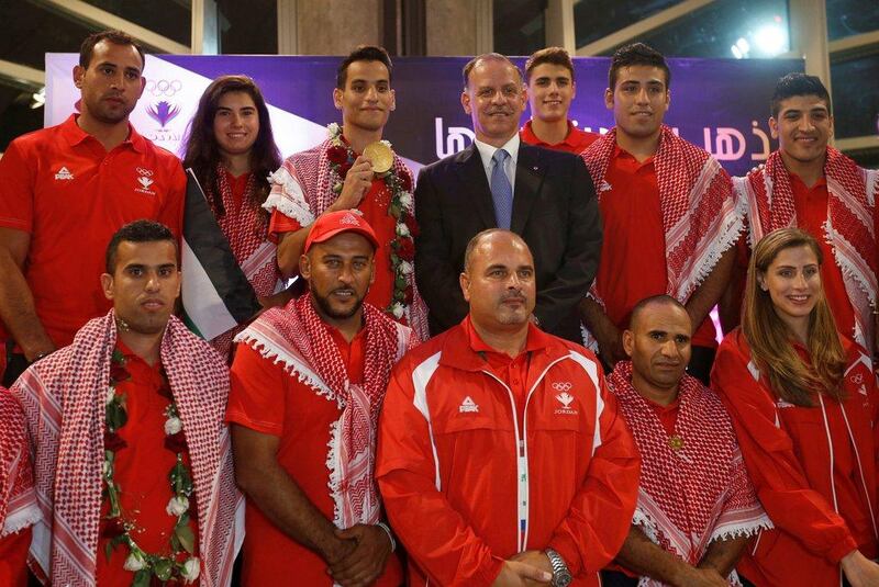 Prince Faisal bin Al Hussein with Ahmad Abughaush and members of the Jordanian Olympic mission. Muhammad Hamed / Reuters