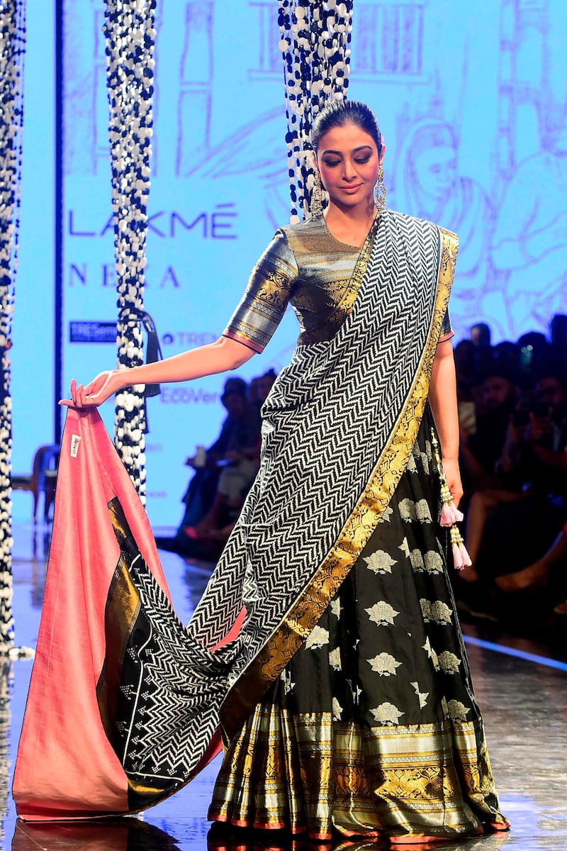 Bollywood actress Tabu presents a creation by designer Gaurang during Lakme Fashion Week in Mumbai on February 14, 2020. AFP