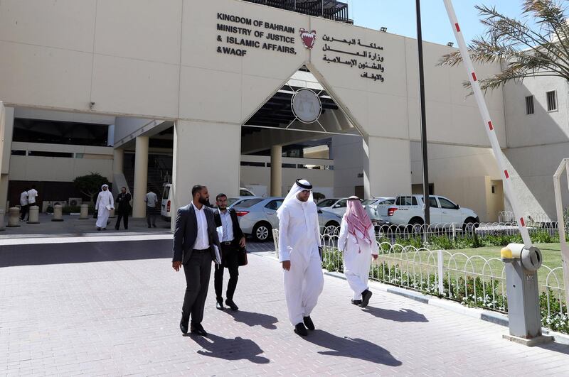 People leave the courthouse compound of Ministry of Justice And Islamic Affairs and WAQF in Manama, Bahrain. Reuters