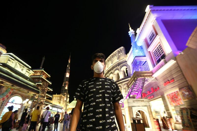 A man wearing a protective mask following an outbreak of coronavirus walks at Global Village in Dubai, UAE, March 10, 2020. Picture taken March 10, 2020. REUTERS/Satish Kumar