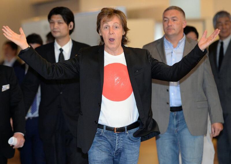The British music legend Paul McCartney upon his arrival at the Haneda airport in Tokyo. AFP Photo / FILES / Toshifumi Kitamura