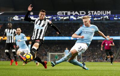 Soccer Football - Premier League - Manchester City vs Newcastle United - Etihad Stadium, Manchester, Britain - January 20, 2018   Manchester City's Oleksandr Zinchenko in action with Newcastle United's Javi Manquillo     REUTERS/Darren Staples    EDITORIAL USE ONLY. No use with unauthorized audio, video, data, fixture lists, club/league logos or "live" services. Online in-match use limited to 75 images, no video emulation. No use in betting, games or single club/league/player publications.  Please contact your account representative for further details.