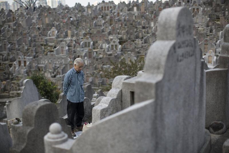 A man prays in front of his deceased relatives’ tomb in Diamond Hill cemetery in Hong Kong. The Qingming Festival, also known as Tomb-Sweeping Day, is marked by Chinese people by going to the cemetery to cleaning up tombs, bring flowers, and making offerings to their ancestors.  EPA