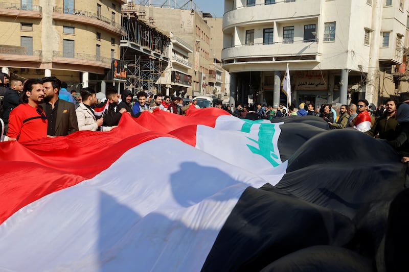 Iraqi protesters demonstrate against the dinar's slide in value against the US dollar. Reuters