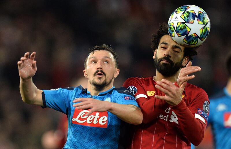 Mohamed Salah of Liverpool in action against Mario Rui of Napoli. EPA